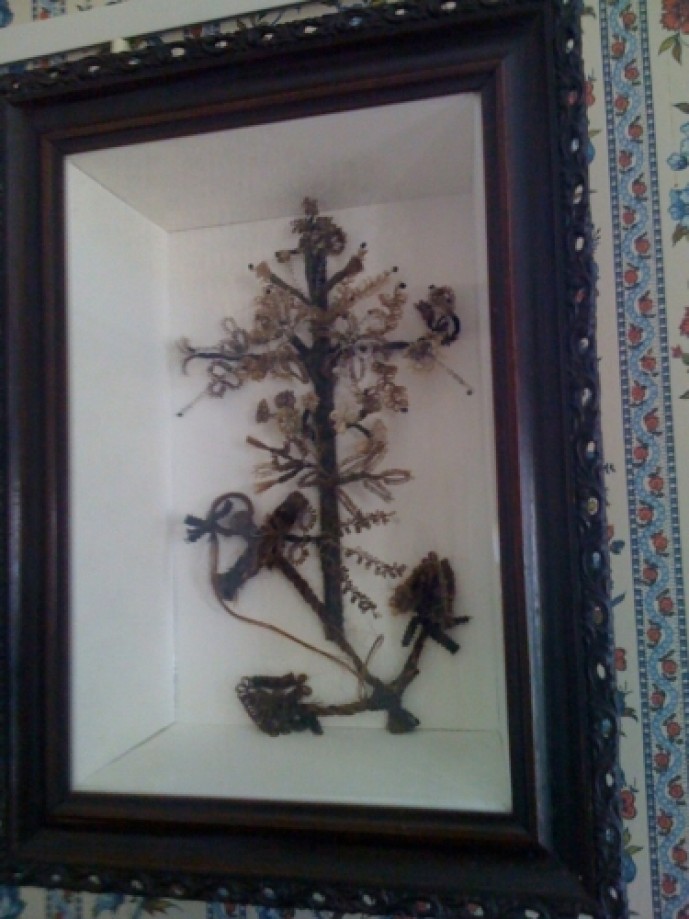 Trip photo #18/48 Hair picture of cross and anchor. It was made from some of the Carpenter family's hair.