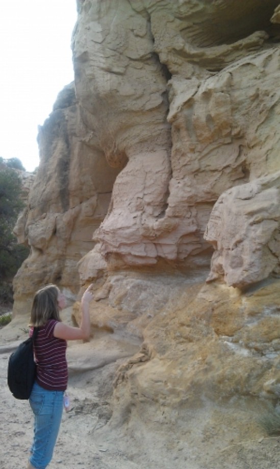 Trip photo #9/17 Tara Pointing to a Small Sandstone Cave